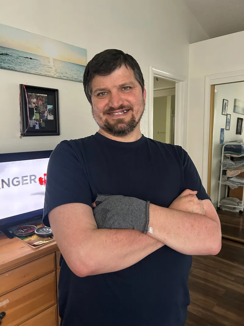 Community member smiling at home